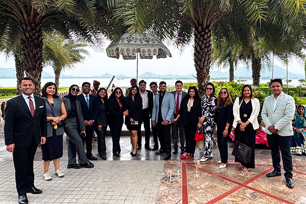 Students and faculty come together by the lake at Raffles Udaipur.