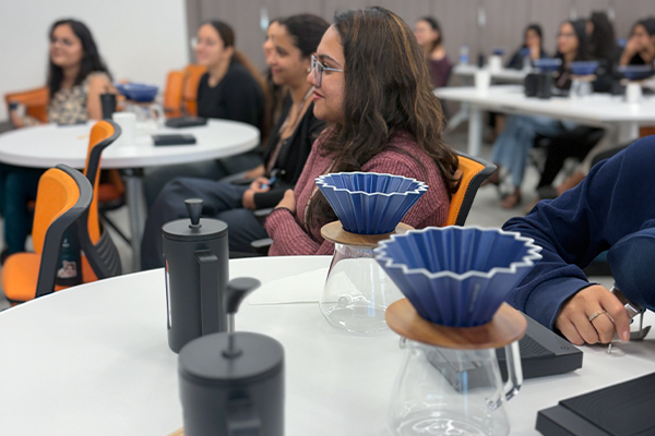 Coffee workshop students brewing French press SP Jain Global